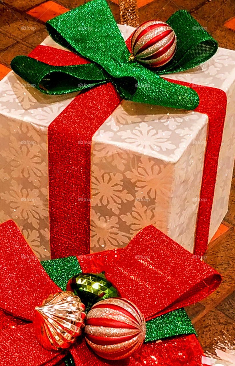 Christmas gifts with red and green ribbon