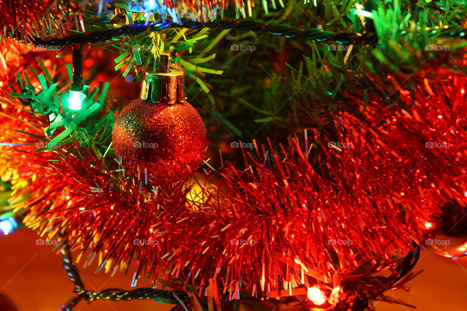 Macro shot of Christmas tree decorations and vivid lights