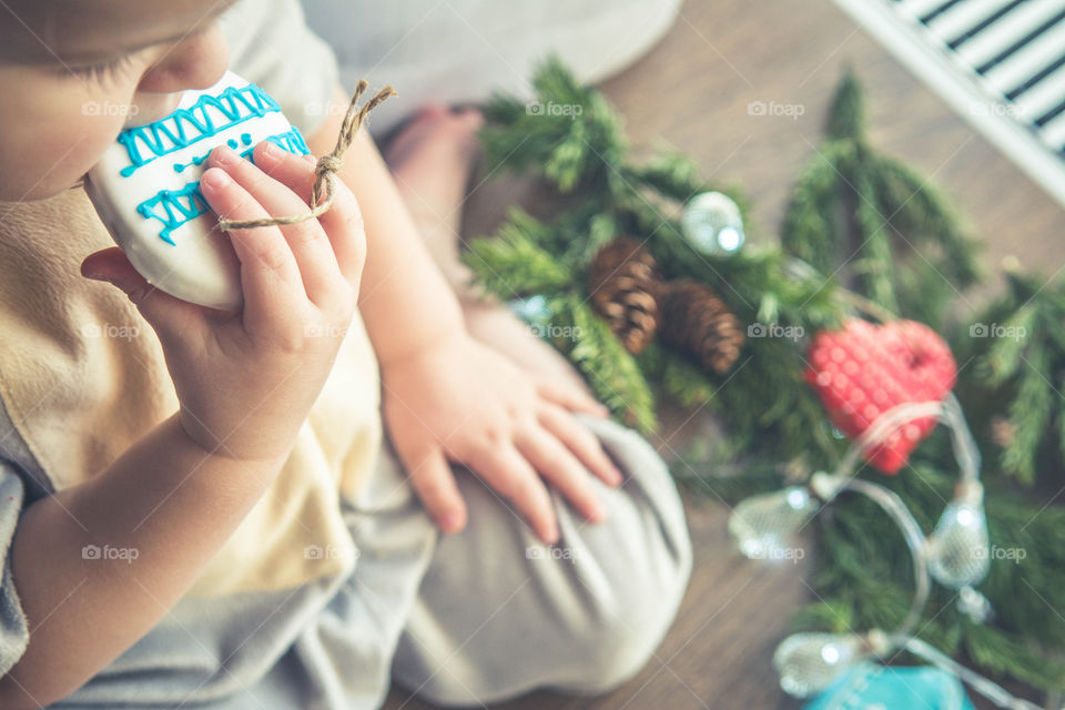 Little boy eating gingerbread