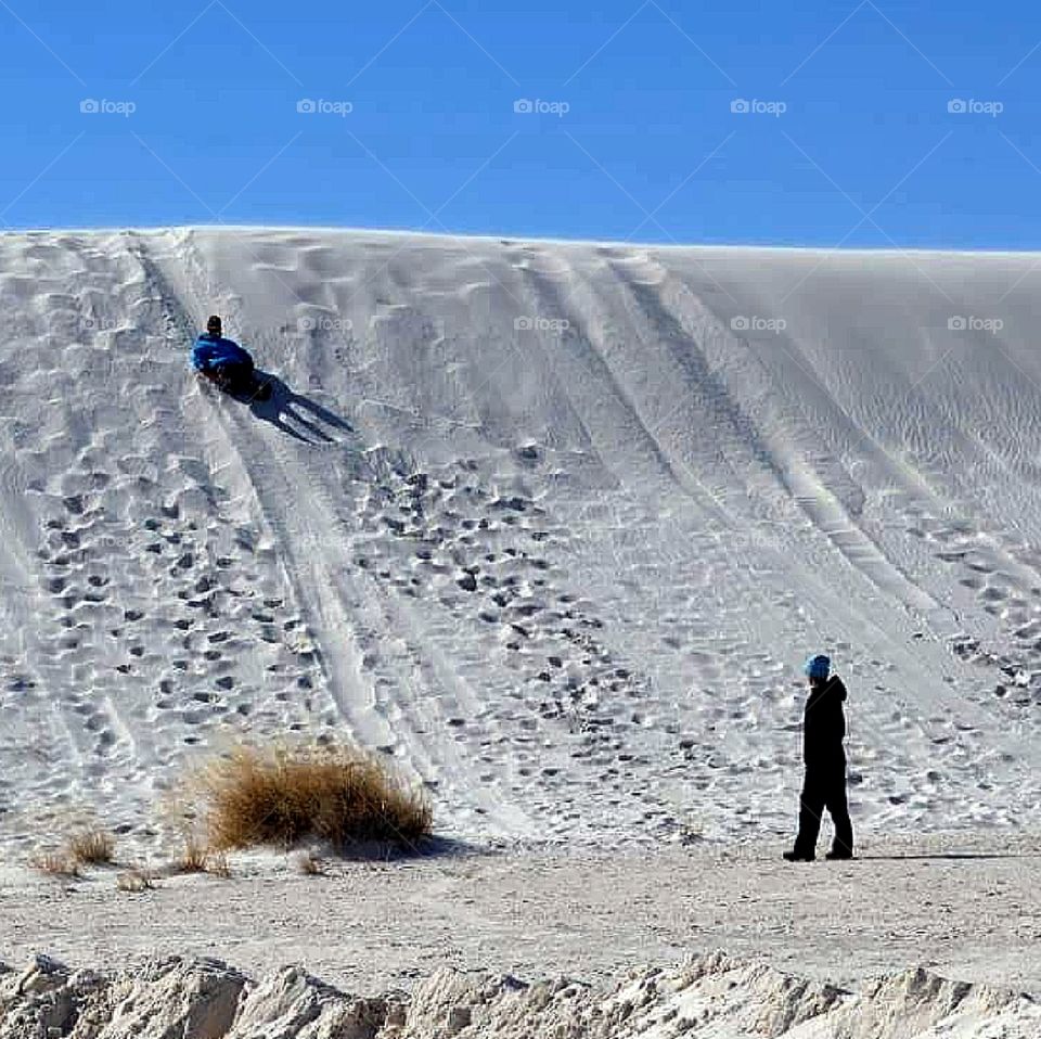 Sledding done the dunes - White Sands National Monument