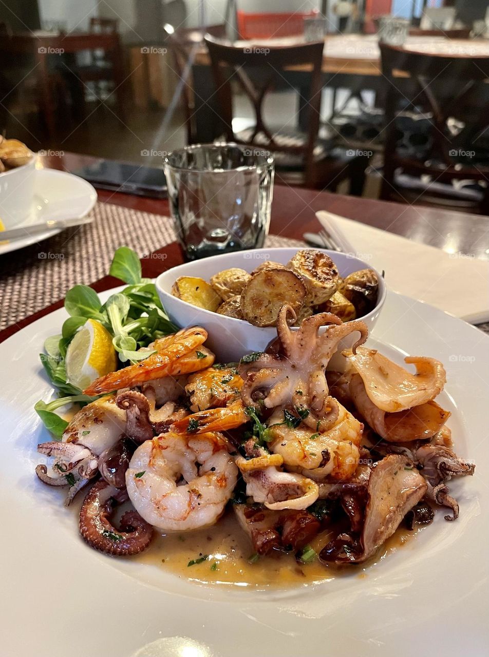 Seafood salad with shrimp and baby octopus 