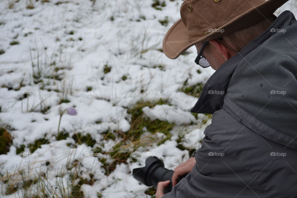 Photographer in the Rocky Mountain alpine meadows