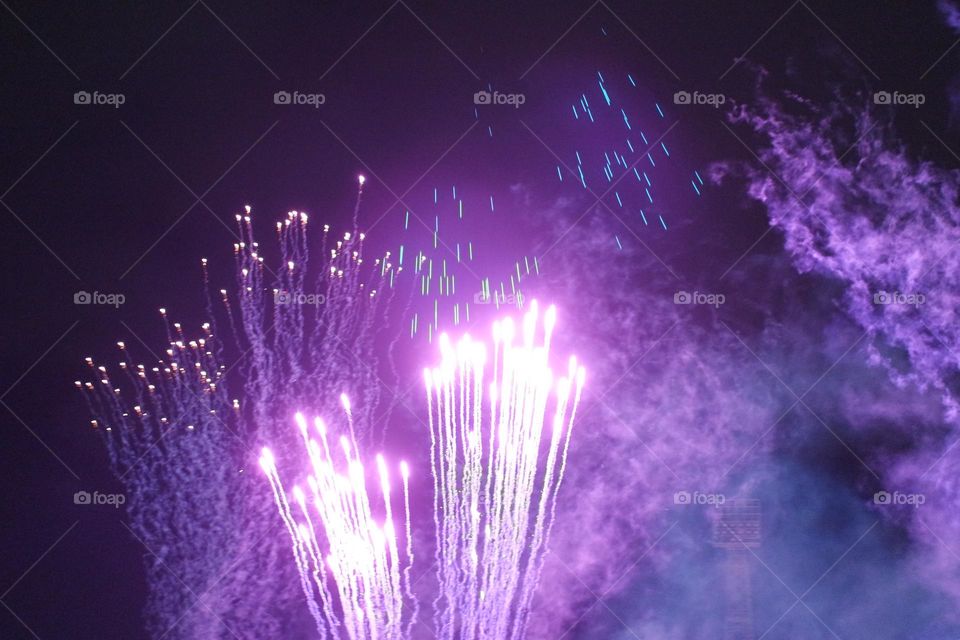Bright explosion of purple colours into the dusky, Smokey already loud and colourful night sky