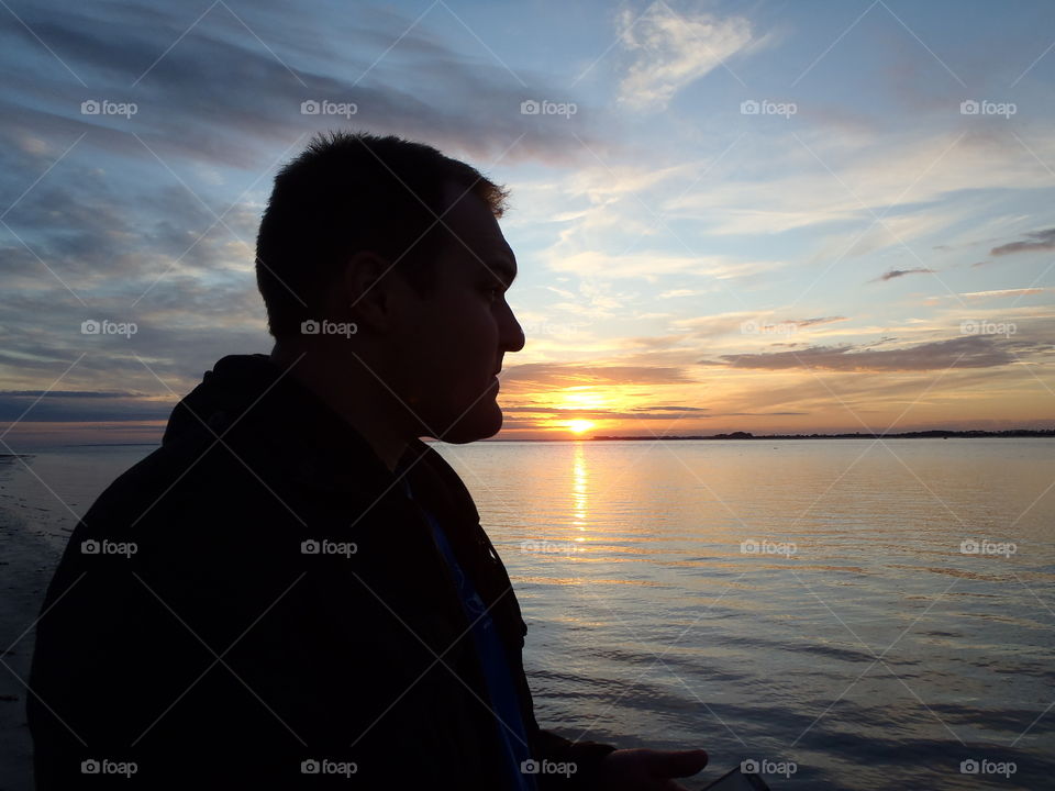 Mans silhouette at sunset