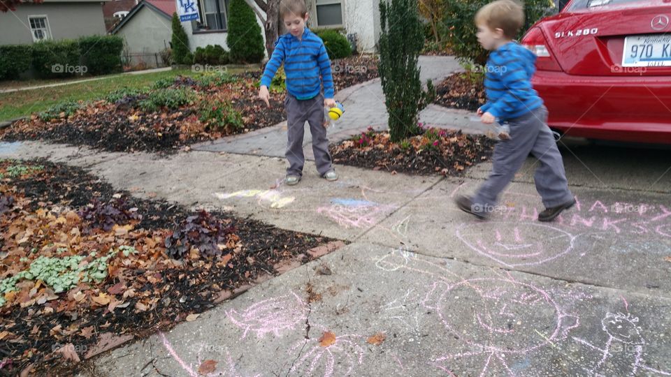 kids playing with chalk