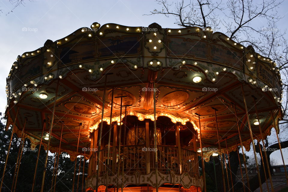 Illuminated carousel at night