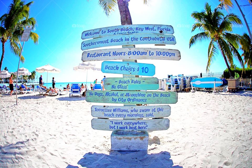 Beach sign with an important message!. Quote Tennessee Williams ~ "I work everywhere, but I work best here"