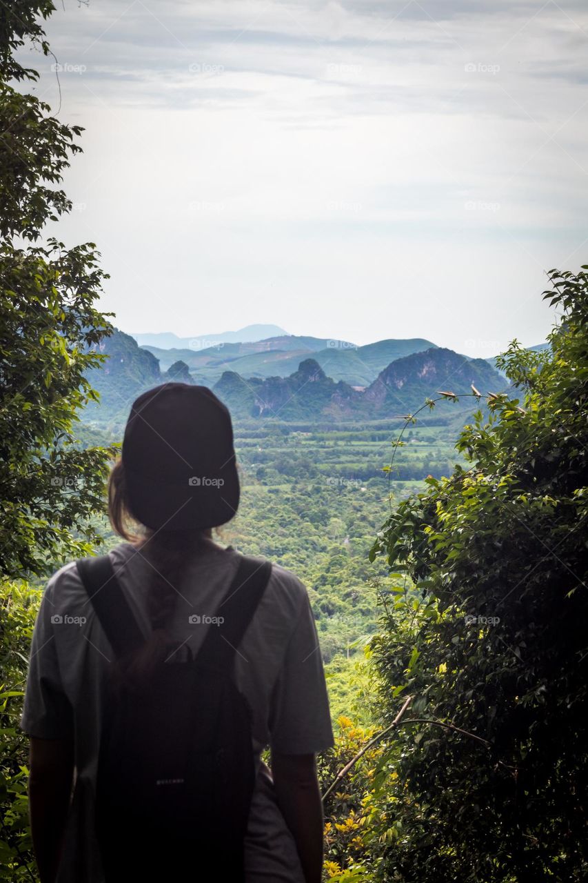 A person enjoying the view of the mountains 