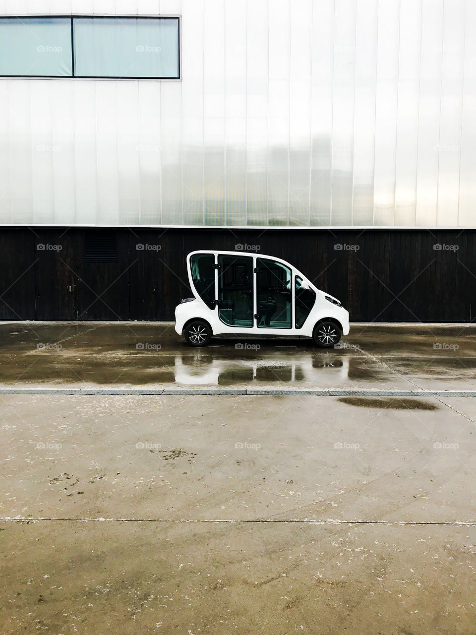 Tiny car in a rainy day 