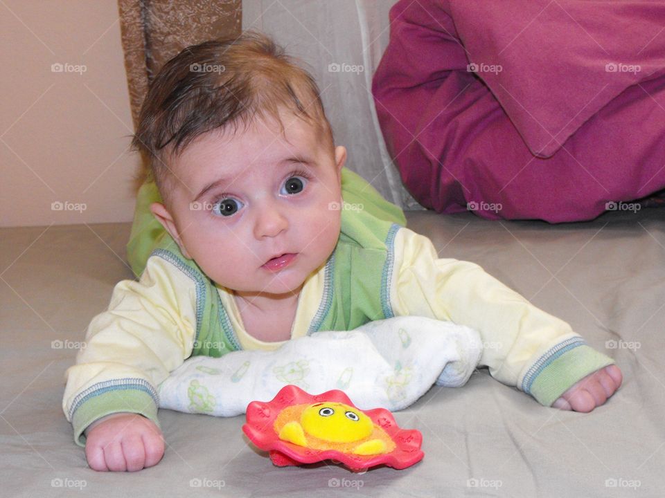 Cute baby in the bedroom 