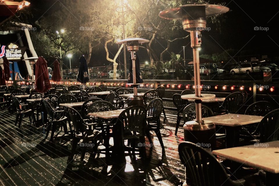 Empty outdoor cafeteria in a rainy night