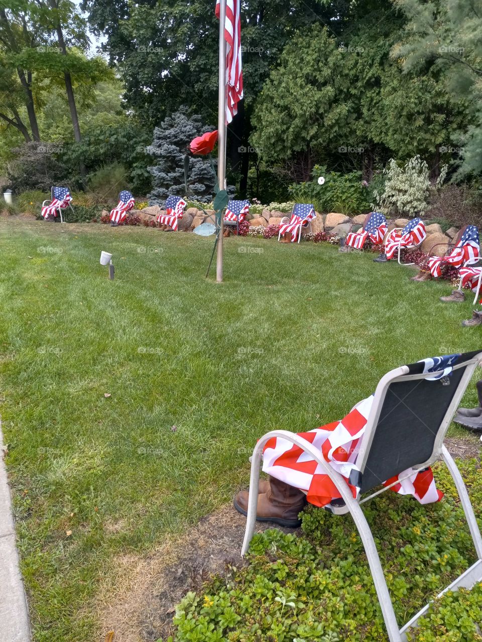 tribute, 13 chairs, 13 pair of boots, 13 flags.