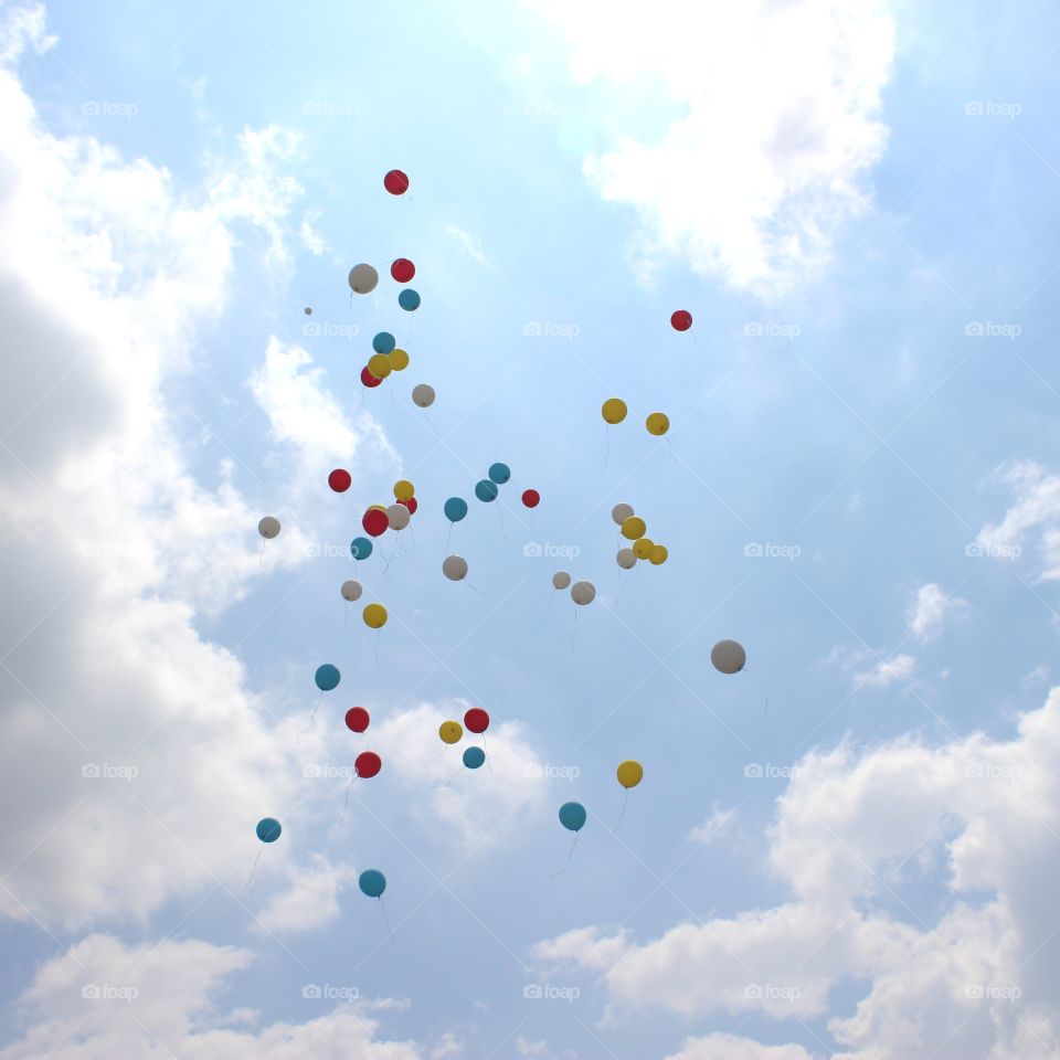 colorful baloons embellish the sky more beautiful as a congratulation for preschool students graduated.