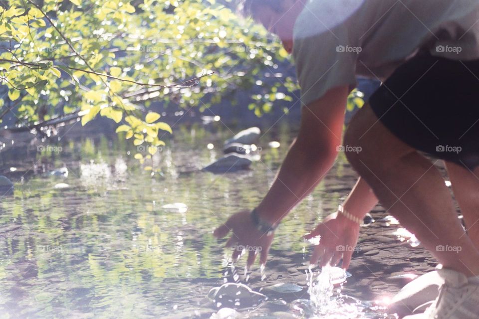 Washing hands in the stream