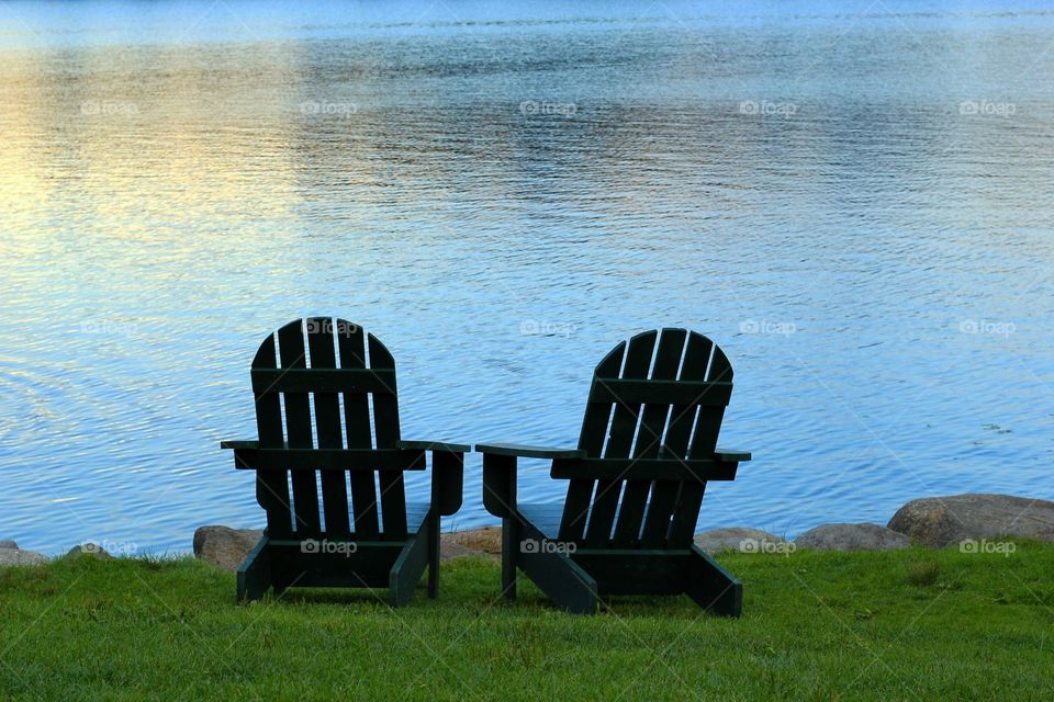 Adirondack chairs by lake
