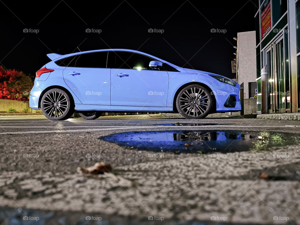 Ford focus in purple blue color at parking in night