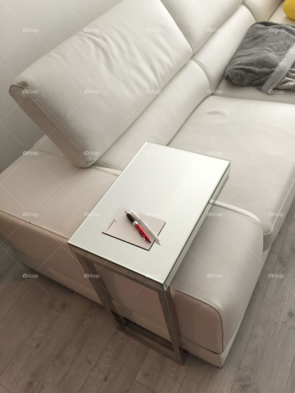 Mirrored side table on a sofa