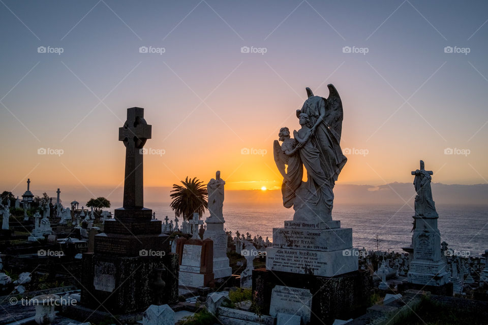 A headless angel at sunrise